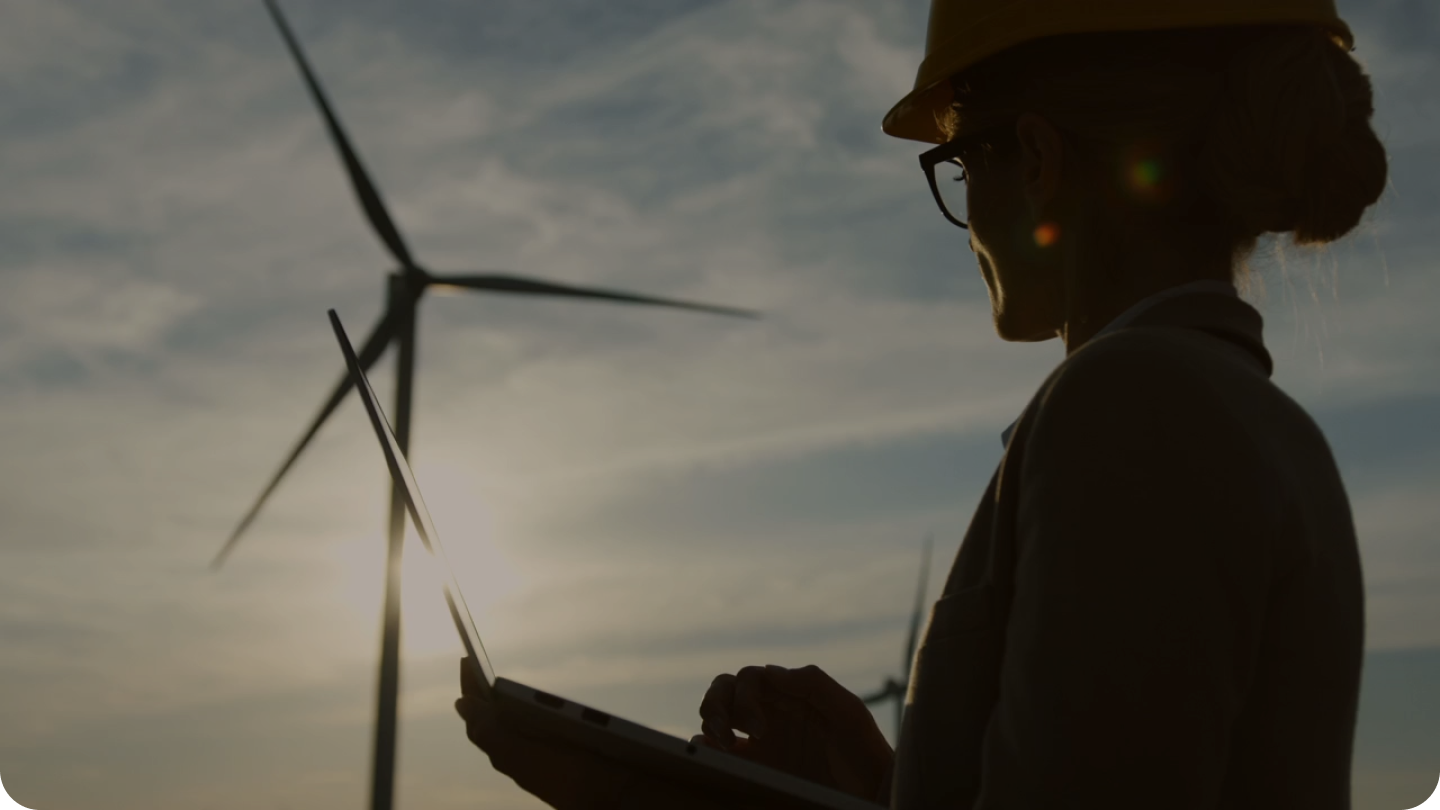 Wind turbine technician inspecting equipment