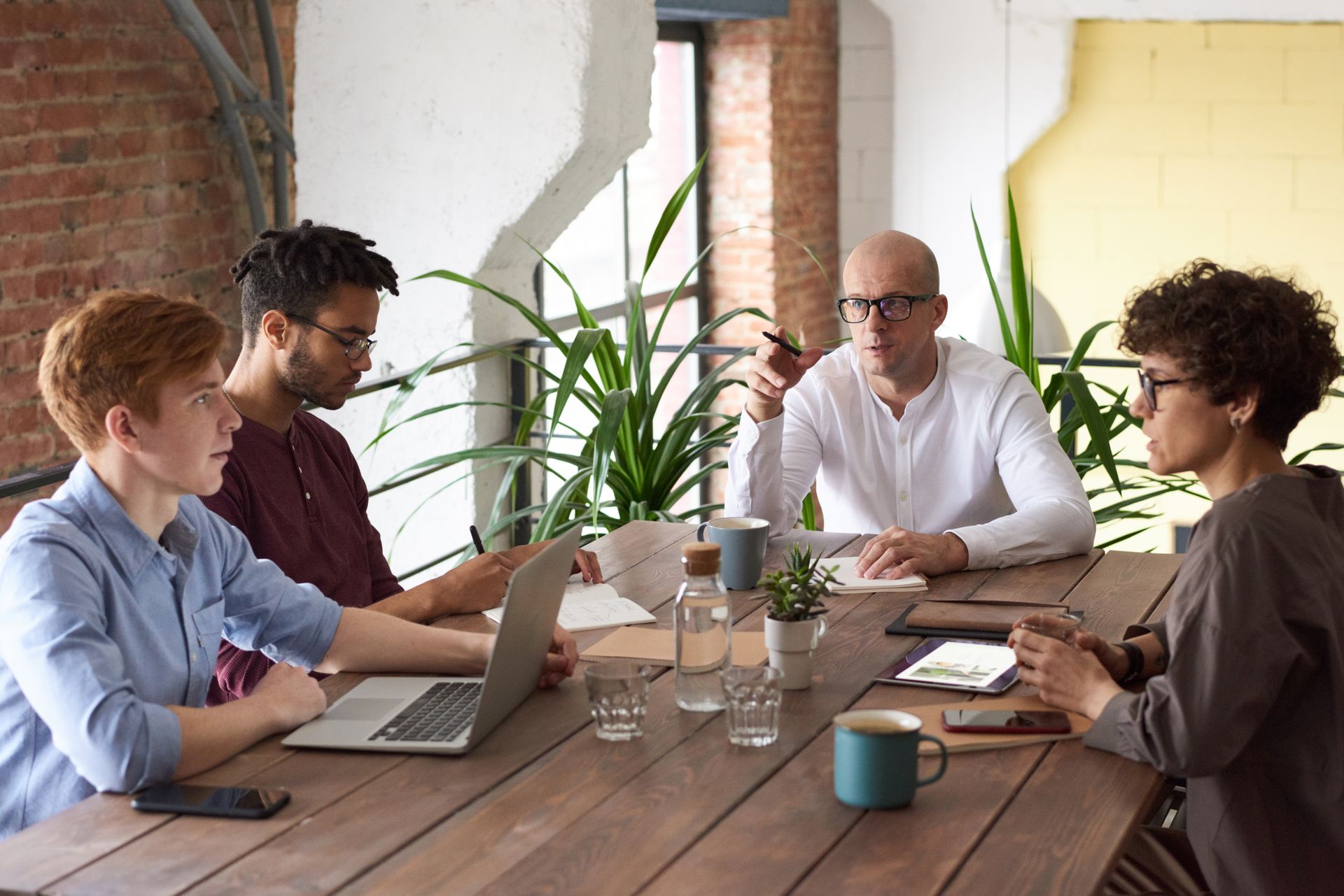 SkySpecs team collaborating around a table