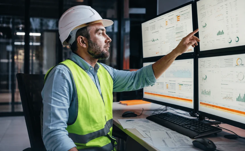Wind operations specialist monitoring turbine data